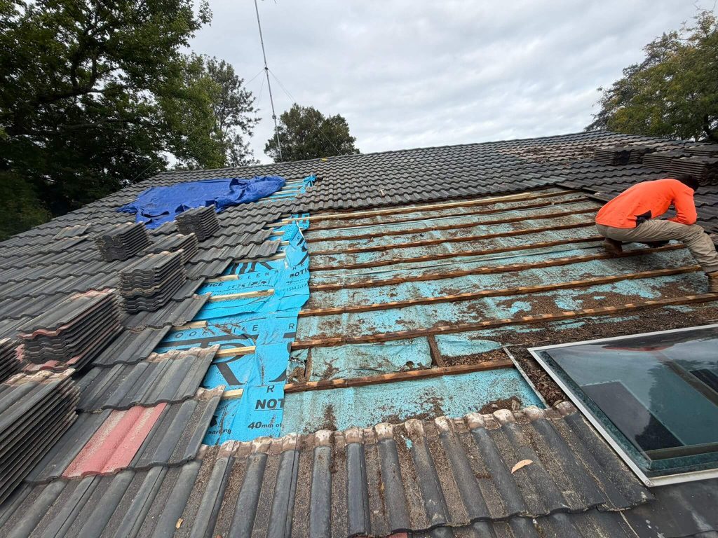 fixing roof slates on house