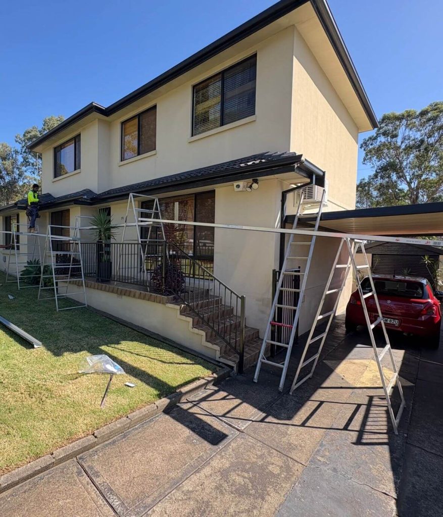installing gutters on a house